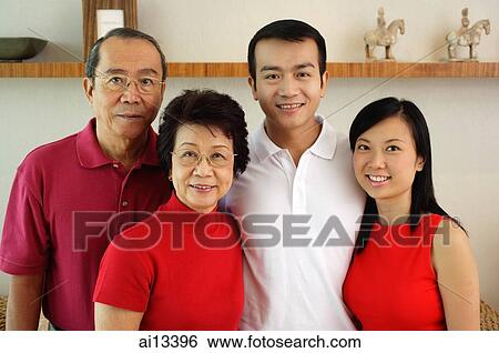Two generation family, looking at camera View Large Photo Image Stock Photograph - Two generation family, looking at camera. Fotosearch