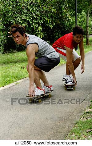 Two guys on skateboards View Large Photo Image Stock Image - Two guys on skateboards. Fotosearch
