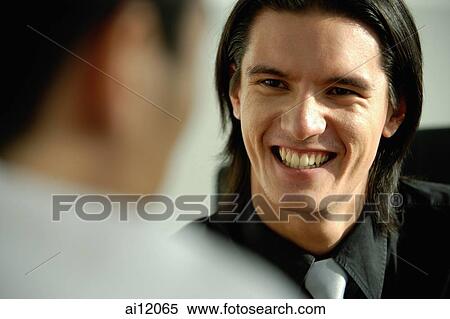 Two men, face to face, over the shoulder view View Large Photo Image Stock Photography - Two men, face to face, over the shoulder view. Fotosearch