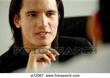 Two men having a discussion View Large Photo Image Stock Photo - Two men having a discussion. Fotosearch