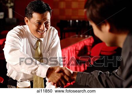 Two men shaking hands. View Large Photo Image Stock Image - Two men shaking hands.. Fotosearch