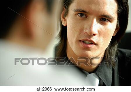 Two men talking, face to face View Large Photo Image Stock Photograph - Two men talking, face to face. Fotosearch