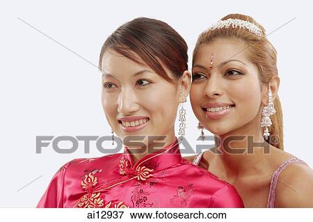 Two women in traditional costumes, looking away, portrait View Large Photo Image Stock Photo - Two women in traditional costumes, looking away, portrait. Fotosearch