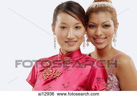 Two women in traditional costumes, looking at camera, portrait View Large Photo Image Stock Photograph - Two women in traditional costumes, looking at camera, portrait. Fotosearch