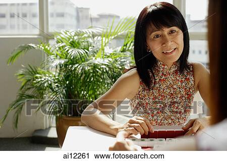 Two women playing mahjong, face to face View Large Photo Image Stock Image - Two women playing mahjong, face to face. Fotosearch
