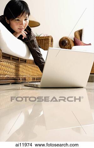 Woman at home, using laptop View Large Photo Image Picture - Woman at home, using laptop. Fotosearch
