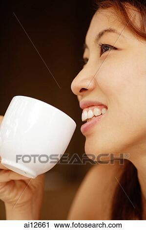 Woman drinking from cup, sideview View Large Photo Image Stock Image - Woman drinking from cup, sideview. Fotosearch