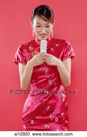 Woman holding mobile phone, text messaging View Large Photo Image Stock Image - Woman holding mobile phone, text messaging. Fotosearch