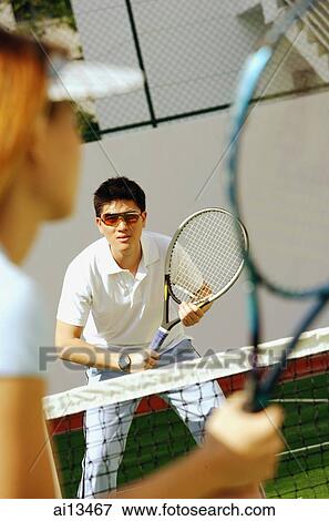Woman holding tennis racket, playing tennis View Large Photo Image Stock Photo - Woman holding tennis racket, playing tennis. Fotosearch