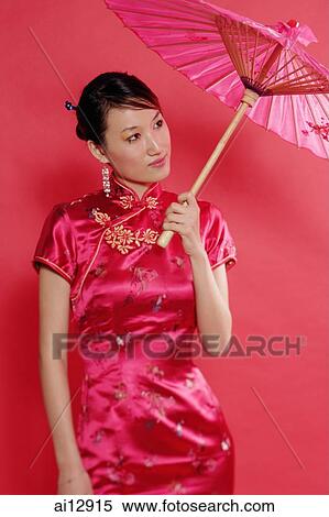 Woman holding umbrella, looking away View Large Photo Image Stock Photography - Woman holding umbrella, looking away. Fotosearch