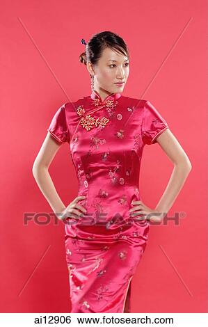 Woman in Cheongsam, hand on hips, looking away View Large Photo Image Stock Photograph - Woman in Cheongsam, hand on hips, looking away. Fotosearch