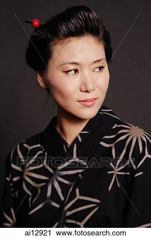Woman in Japanese costume, looking away, portrait View Large Photo Image Stock Image - Woman in Japanese costume, looking away, portrait. Fotosearch