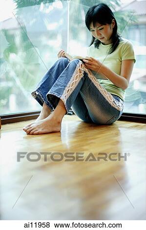 Woman leaning on window, reading a book View Large Photo Image Stock Photo - Woman leaning on window, reading a book. Fotosearch