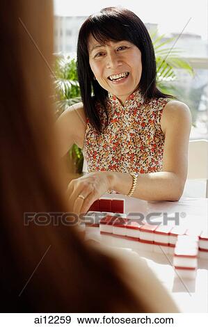 Woman playing mahjong, portrait View Large Photo Image Stock Photo - Woman playing mahjong, portrait. Fotosearch