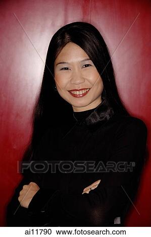 Woman with arms crossed, looking at camera. View Large Photo Image Stock Image - Woman with arms crossed, looking at camera.. Fotosearch