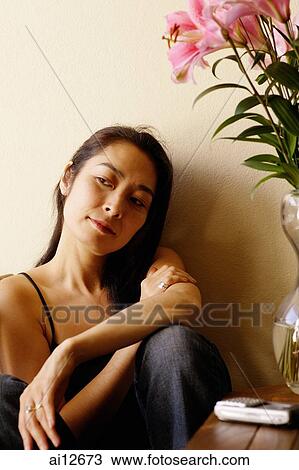 Woman with arms crossed, looking away View Large Photo Image Stock Image - Woman with arms crossed, looking away. Fotosearch