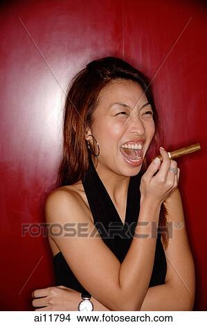 Picture - Woman with cigar, laughing.. Fotosearch