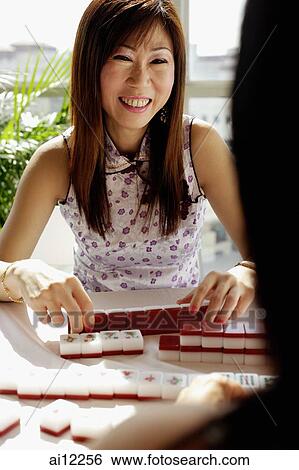 Women playing mahjong, face to face View Large Photo Image Stock Photograph - Women playing mahjong, face to face. Fotosearch