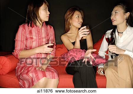 Women with drinks, talking View Large Photo Image Stock Photograph - Women with drinks, talking. Fotosearch