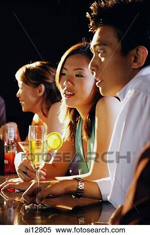 Young adults sitting at bar View Large Photo Image Stock Photography - Young adults sitting at bar. Fotosearch