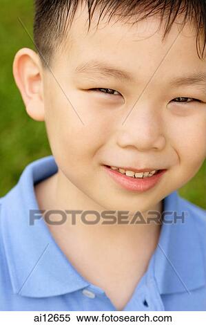 Young boy looking at camera, portrait View Large Photo Image Stock Photography - Young boy looking at camera, portrait. Fotosearch