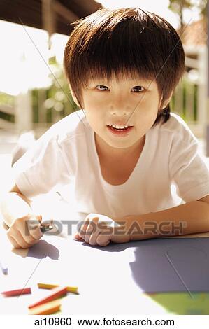 Young boy looking at camera View Large Photo Image Stock Image - Young boy looking at camera. Fotosearch
