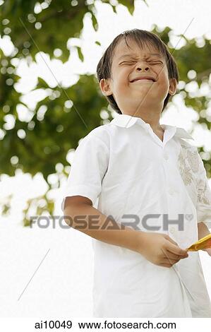 Young boy making a face View Large Photo Image Stock Photo - Young boy making a face. Fotosearch