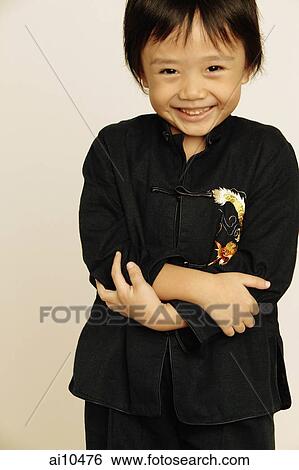 Young boy smiling, looking at camera View Large Photo Image Stock Photograph - Young boy smiling, looking at camera. Fotosearch