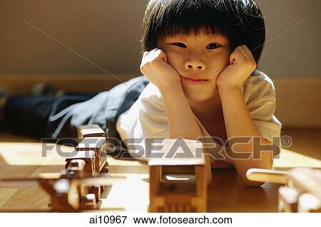 Young boy with hands on head, looking at camera View Large Photo Image Stock Photo - Young boy with hands on head, looking at camera. Fotosearch
