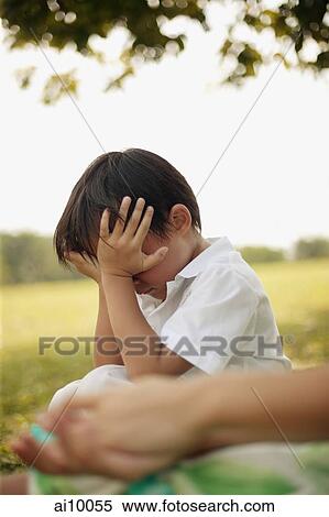 Young boy with hands on his face View Large Photo Image Stock Photography - Young boy with hands on his face. Fotosearch