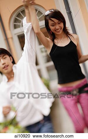 Young couple holding hands. View Large Photo Image Stock Image - Young couple holding hands.. Fotosearch