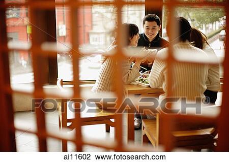 Young couples at a Chinese restaurant View Large Photo Image Stock Image - Young couples at a Chinese restaurant. Fotosearch