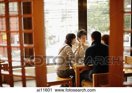 Young couples eating at a Chinese restaurant View Large Photo Image Stock Image - Young couples eating at a Chinese restaurant. Fotosearch