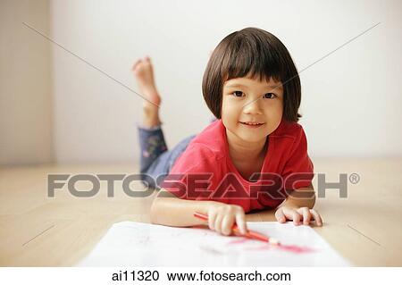 Young girl drawing, looking at camera View Large Photo Image Stock Image - Young girl drawing, looking at camera. Fotosearch