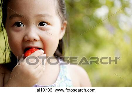 Young girl eating, portrait View Large Photo Image Stock Image - Young girl eating, portrait. Fotosearch