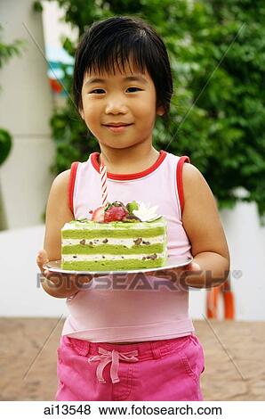 Young girl holding cake View Large Photo Image Stock Photo - Young girl holding cake. Fotosearch