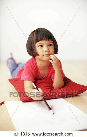 Young girl holding pencil, drawing on drawing pad View Large Photo Image Stock Photography - Young girl holding pencil, drawing on drawing pad. Fotosearch