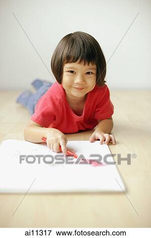 Young girl holding pencil, looking at camera View Large Photo Image Stock Photo - Young girl holding pencil, looking at camera. Fotosearch