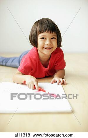 Young girl holding pencil, looking at camera View Large Photo Image Stock Photo - Young girl holding pencil, looking at camera. Fotosearch