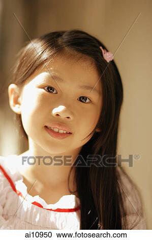Young girl looking at camera View Large Photo Image Stock Image - Young girl looking at camera. Fotosearch