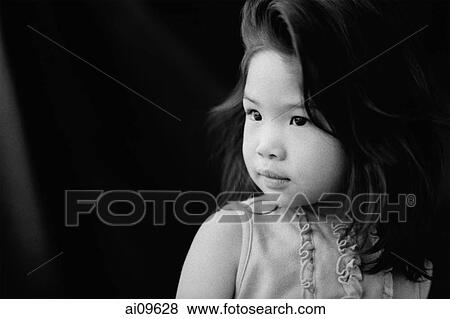 Stock Photo - Young girl looking sideways, portrait. Fotosearch
