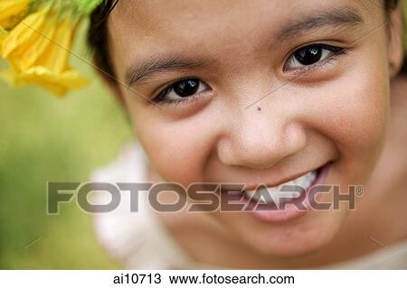 Young girl smiling, looking at camera View Large Photo Image Stock Image - Young girl smiling, looking at camera. Fotosearch
