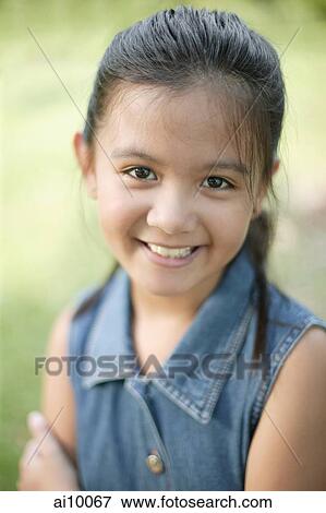 Young girl smiling, portrait View Large Photo Image Stock Photo - Young girl smiling, portrait. Fotosearch