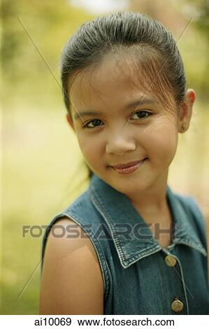 Young girl smiling, portrait View Large Photo Image Stock Photo - Young girl smiling, portrait. Fotosearch