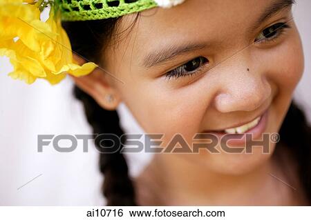 Stock Photograph - Young girl smiling, portrait. Fotosearch
