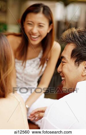 Young man in profile, young woman in front of him, smiling View Large Photo Image Stock Image - Young man in profile, young woman in front of him, smiling. Fotosearch