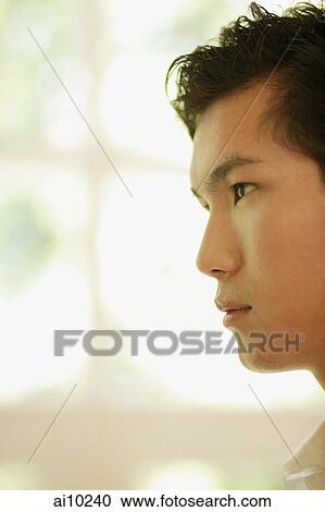 Young man looking ahead, side view View Large Photo Image Stock Image - Young man looking ahead, side view. Fotosearch