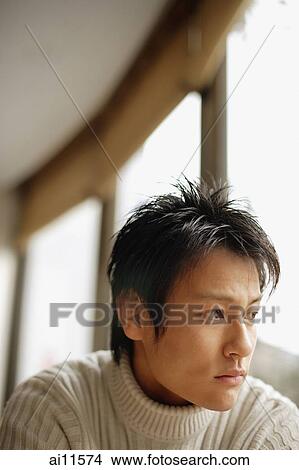Young man looking away, portrait. View Large Photo Image Picture - Young man looking away, portrait.. Fotosearch