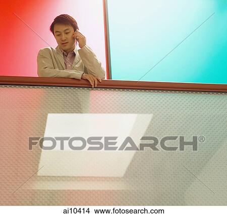 Young man on mobile phone View Large Photo Image Picture - Young man on mobile phone. Fotosearch