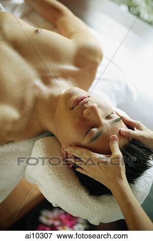 Young man receiving head massage, eyes closed View Large Photo Image Stock Photo - Young man receiving head massage, eyes closed. Fotosearch